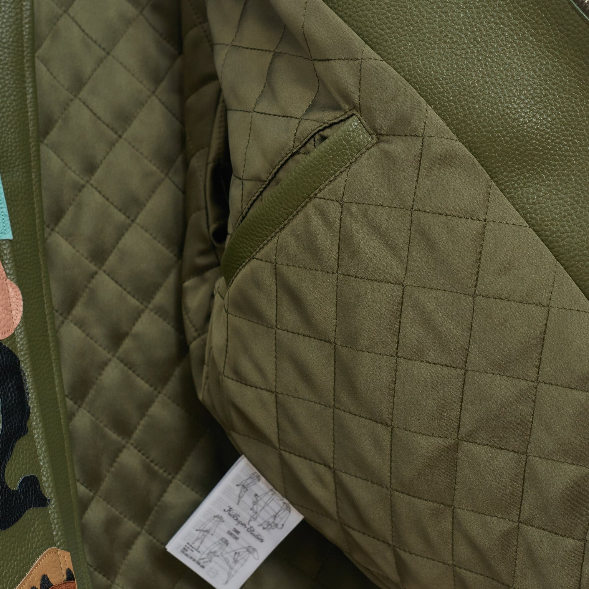 Kidsuper Patchwork Face Leather Varsity Jacket